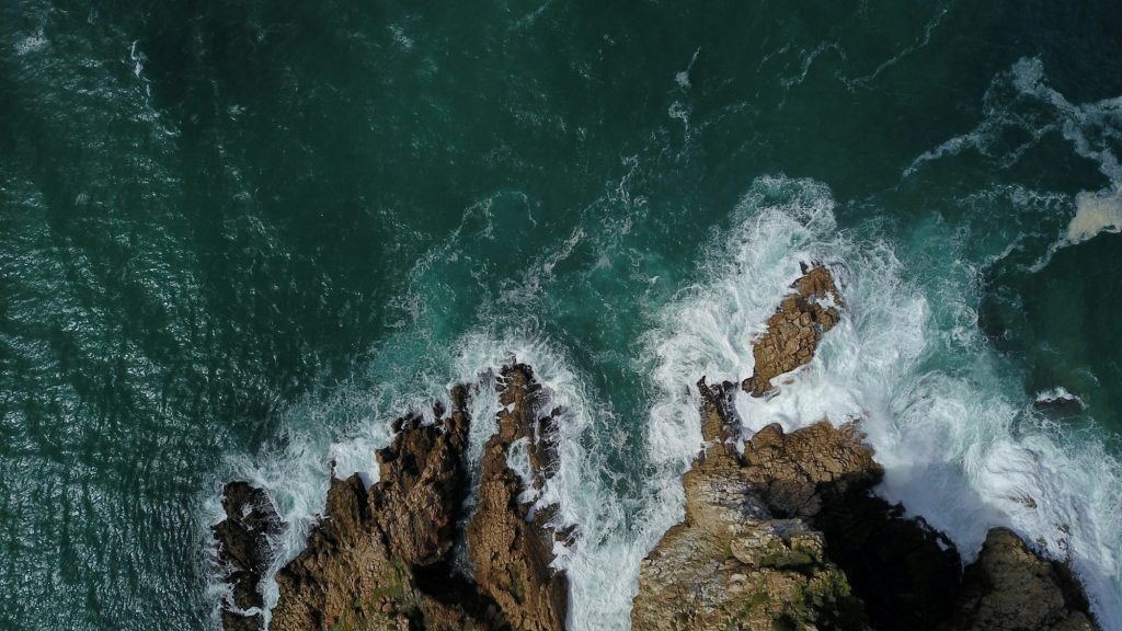 Aerial view of the ocean and rocky coastline at Knysna Heads