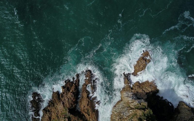 Aerial view of the ocean and rocky coastline at Knysna Heads